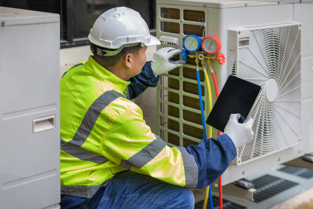 Professional Heat Pump Repair technician working in Athens, IN